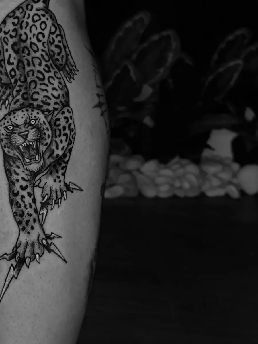 Blackwork tattoo by Eunny — dense solid black with high-contrast negative space